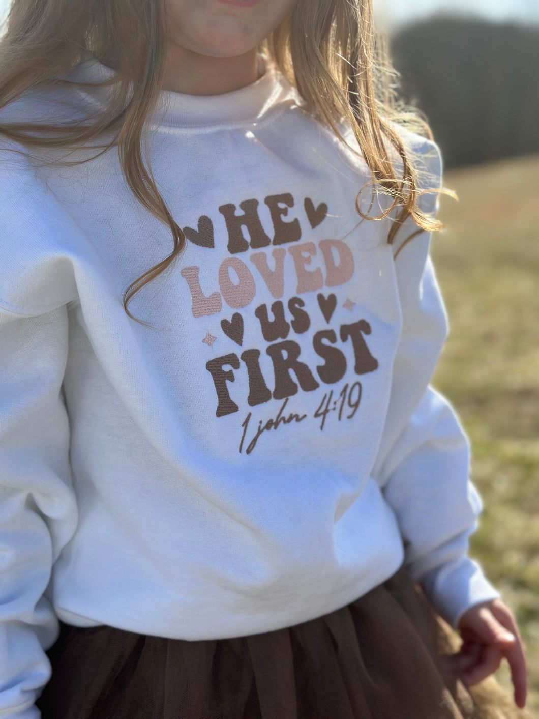 “He loved us first” embroidered crewneck